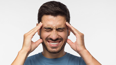 patient needs headache chiropractor in Oklahoma City OK