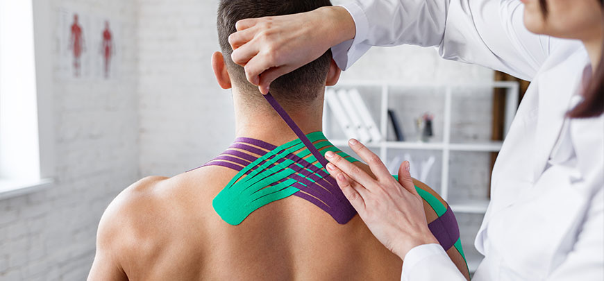 patient receiving kinesio taping in Oklahoma City